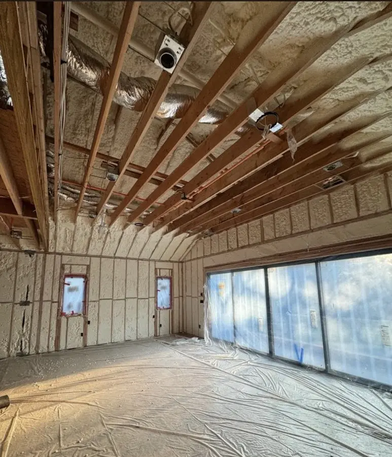 Interior walls and ceiling insulated with spray foam during new construction in Laredo